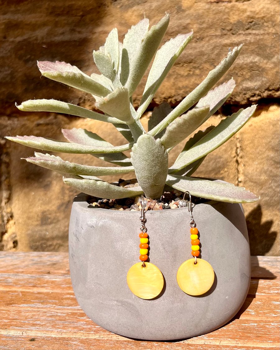 Yellow beaded dangle earrings