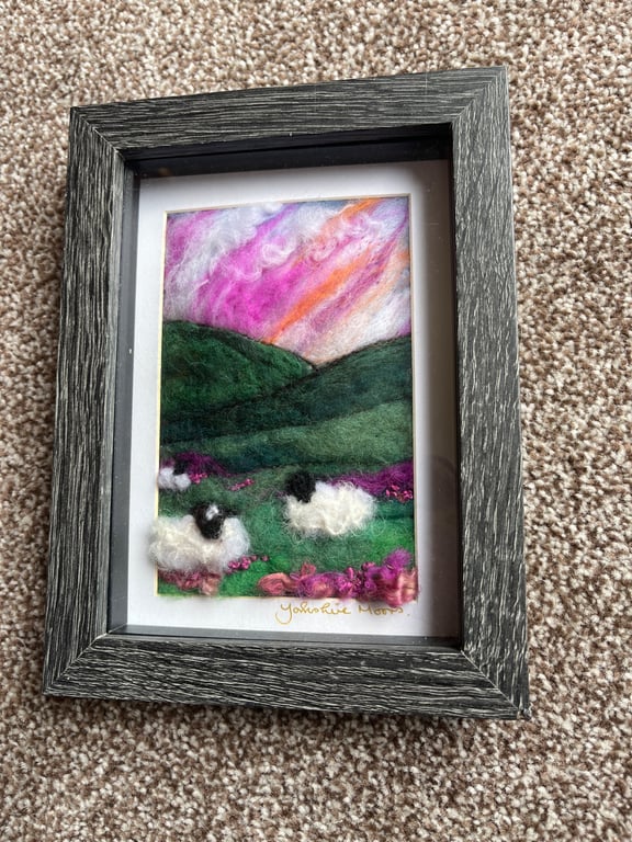 Sheep on a hill on the moors pink sunset   needle felt black frame 