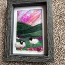 Sheep on a hill on the moors pink sunset   needle felt black frame 