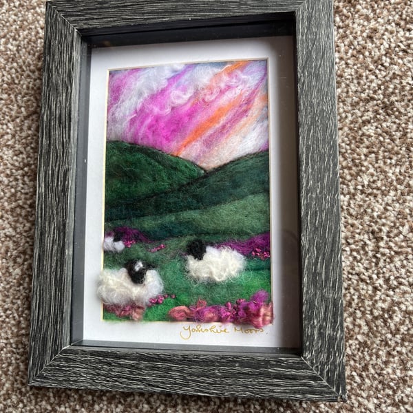 Sheep on a hill on the moors pink sunset   needle felt black frame 