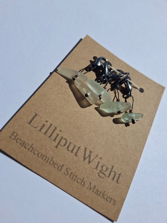 Five sea glass progress keeper stitch markers in shades of sea foam