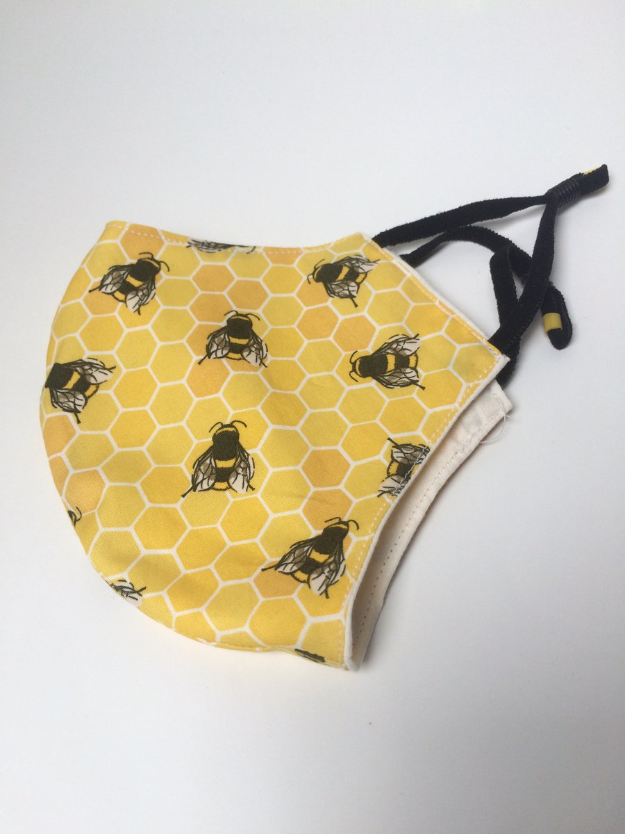 Medium size, double layered face masks in various bumble bee fabrics.