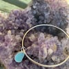 Light blue sea glass charm on bangle with sterling silver