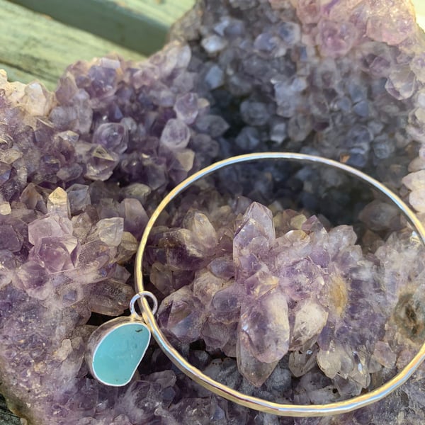 Light blue sea glass charm on bangle with sterling silver