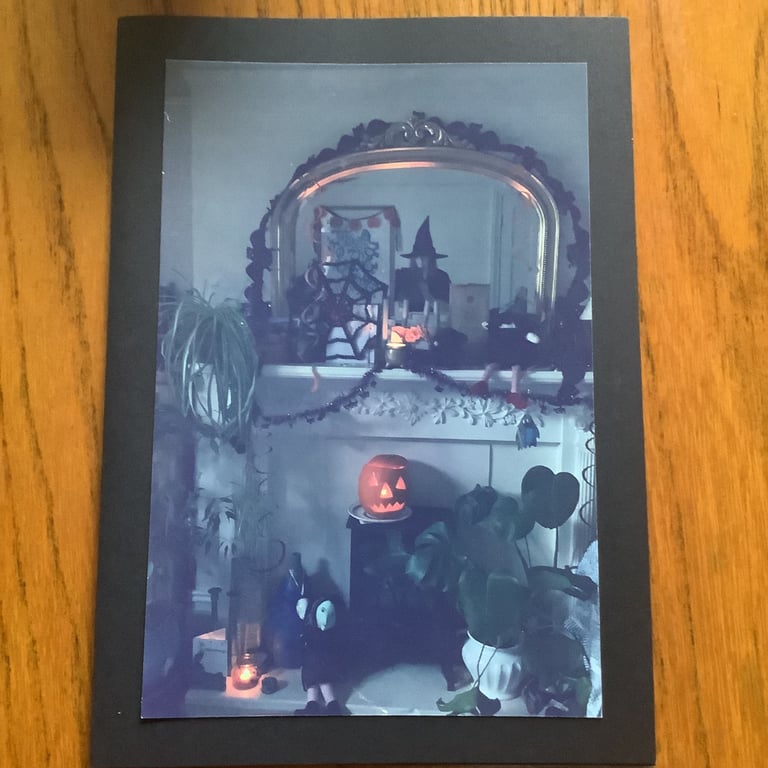 Handmade photo card of Halloween at home.