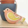 Ceramic bird decoration with patterned wing and tail 