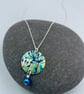 Lime green and blue anodised aluminium cow parsley circle pendant with pearl 