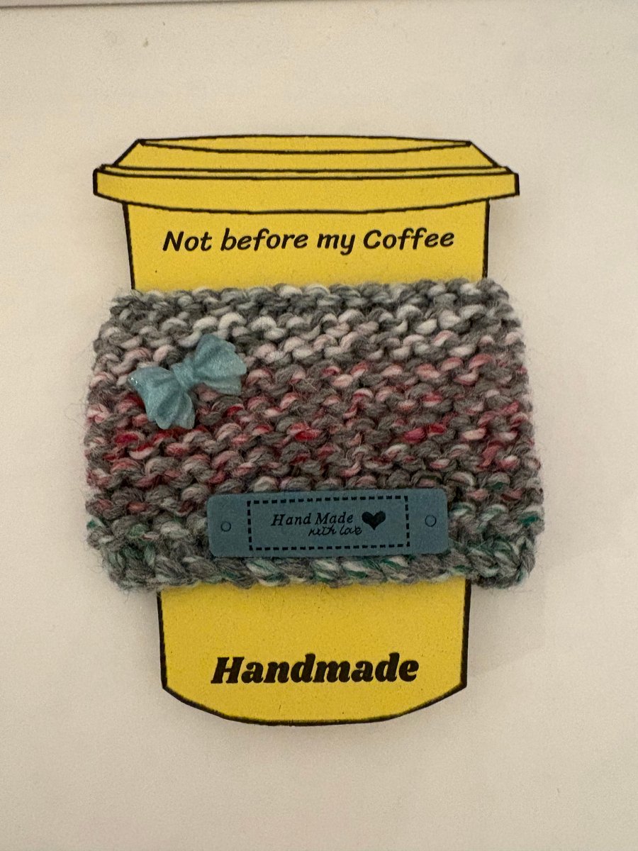 Green bow knitted cup cosy. 