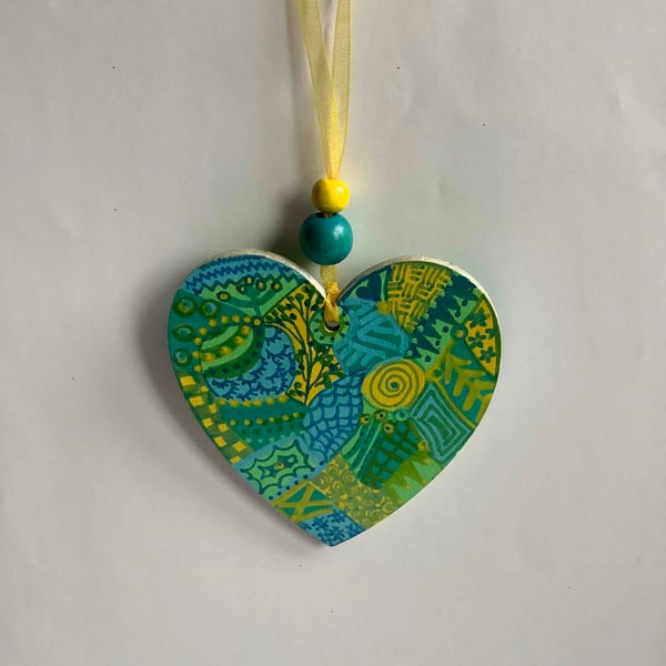 Blue, green and yellow doodle wooden heart