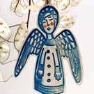 Ceramic Angel decoration in blue shadow