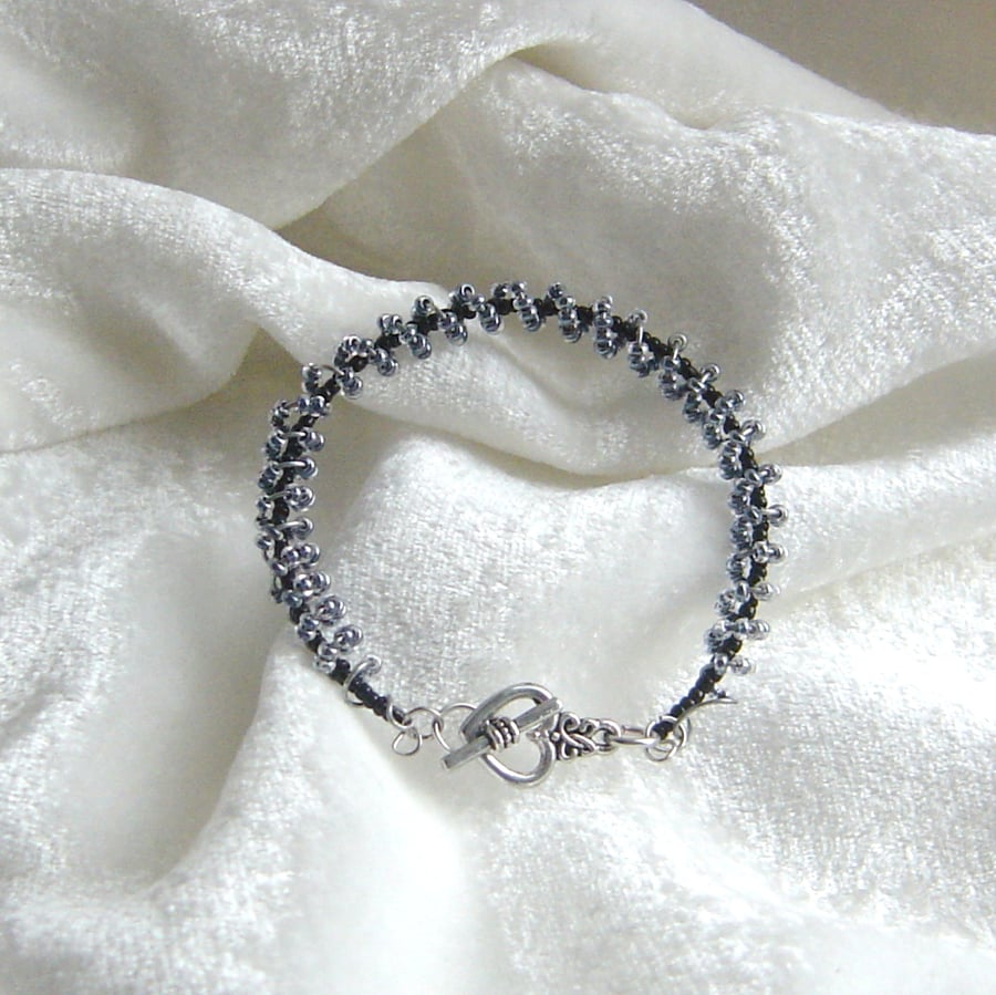 Spirals in black bead bracelet