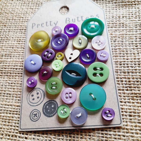 A curated collection of pretty vintage buttons in emerald and purple shades