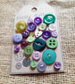 A curated collection of pretty vintage buttons in emerald and purple shades