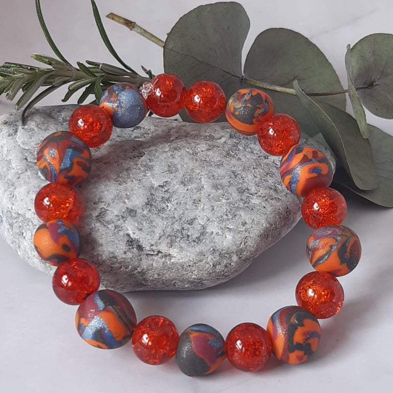 Orange multi coloured polymer clay stretch beaded bracelet