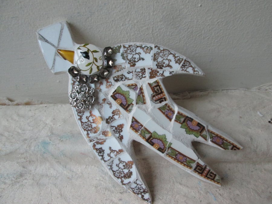 Flying Bird with letter mosaic