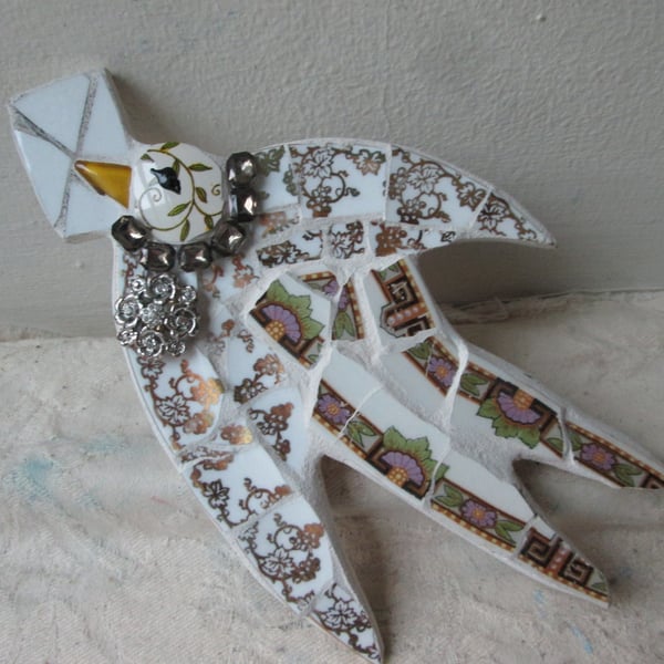 Flying Bird with letter mosaic