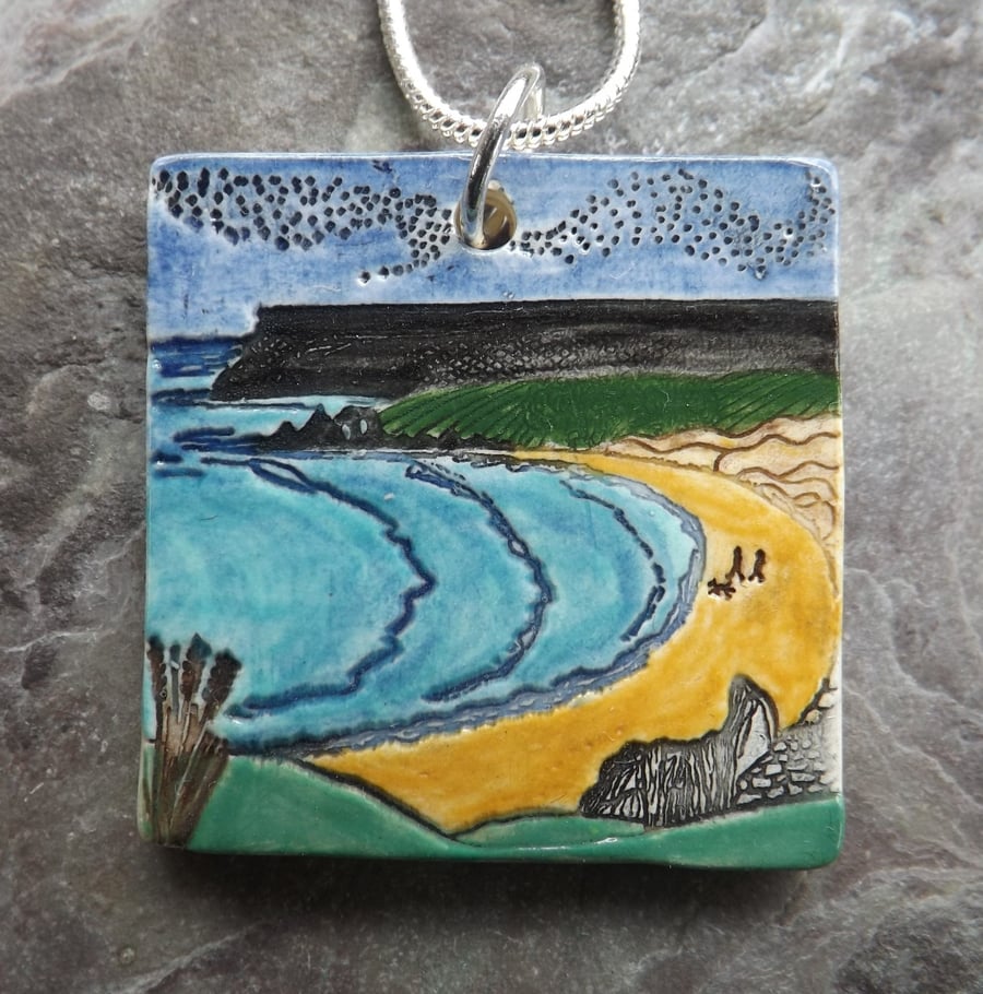 Handmade Ceramic Welsh beach pendant in turquoise blue and yellow