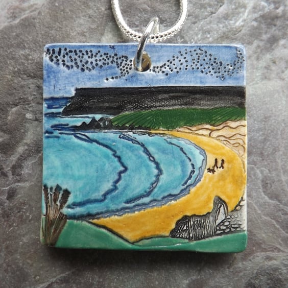 Handmade Ceramic Welsh beach pendant in turquoise blue and yellow
