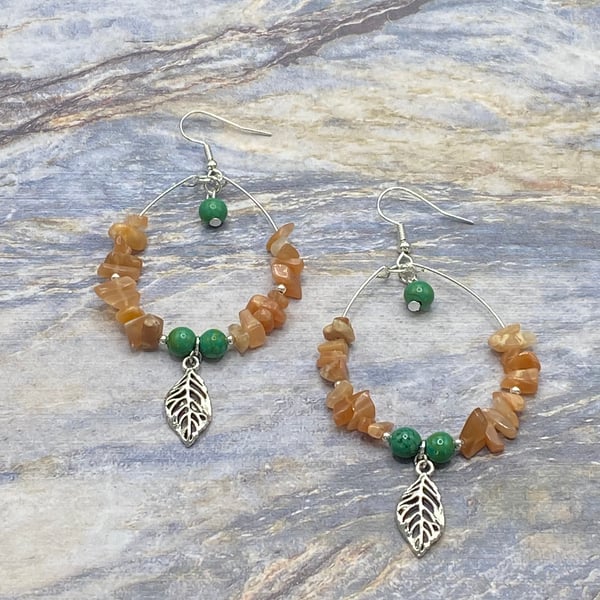 Wire teardrop earrings with silver tone leaf charms and peach moonstone chips