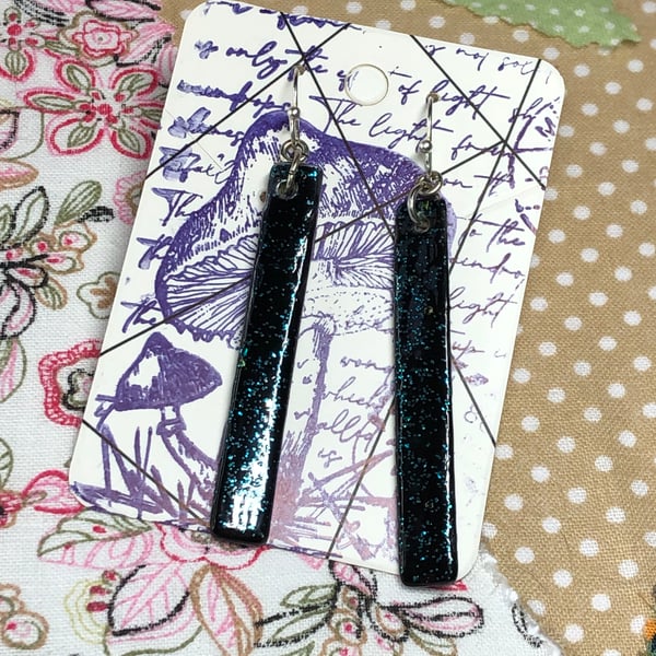 Long black glitter shell earrings