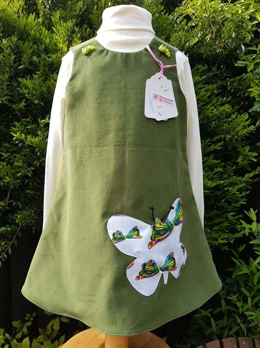Olive green baby needlecord pinafore dress. Age: 4-5 years. Free postage to UK