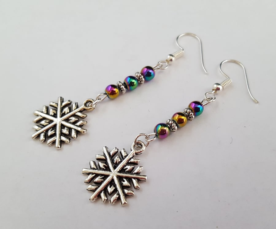 Silver snowflake earrings with rainbow Mardi Gras beads