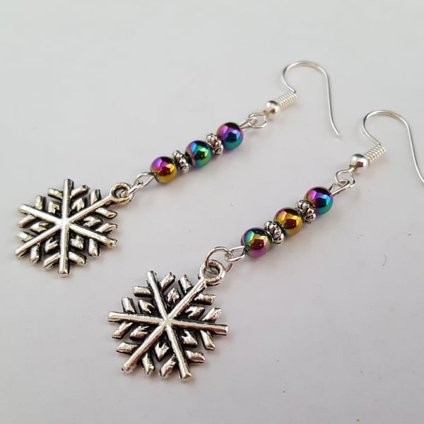 Silver snowflake earrings with rainbow Mardi Gras beads