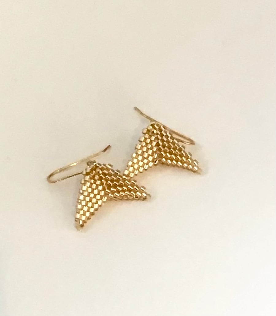 Gold beaded arrowhead earrings