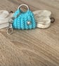 Small bag key, ear buds, coins hol