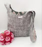 Reversible grey and patterned knot bag.  - Image 8