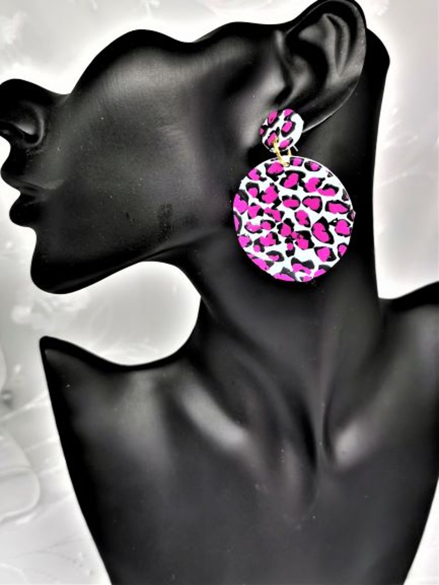 Vivid leopard print earrings, blue and pink. Large, round statement earrings. 
