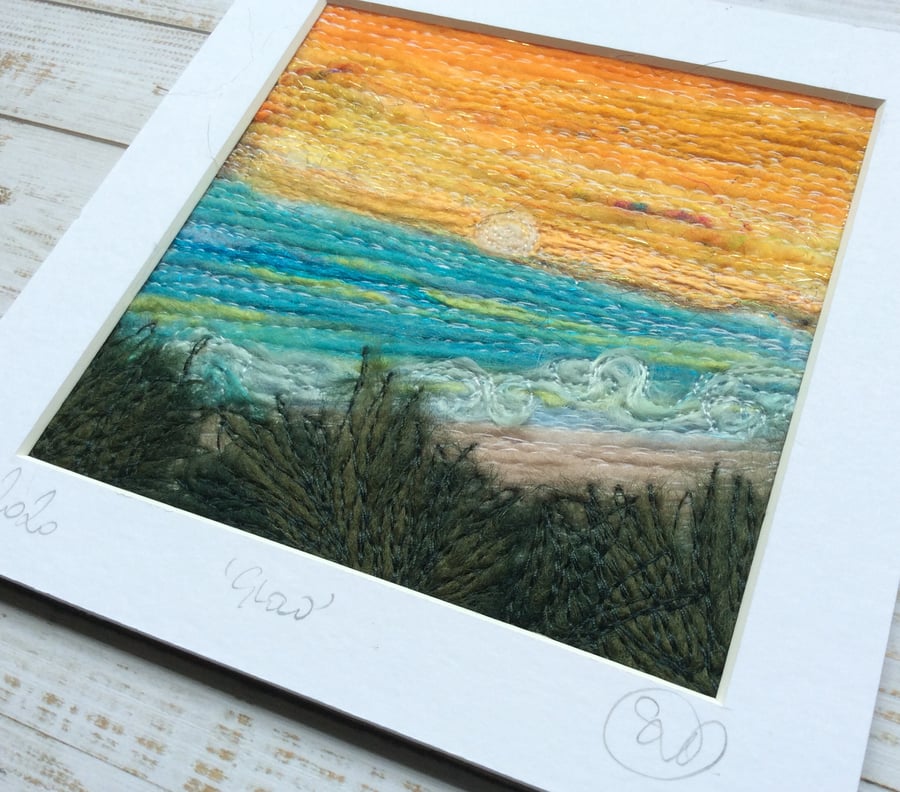 Embroidered sunset beach seascape. 