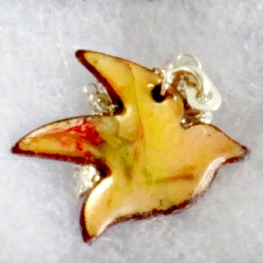 bird pendant - scrolled yellow and red on clear enamel