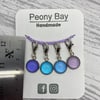 Set of 4 stitch markers in blue and lilac
