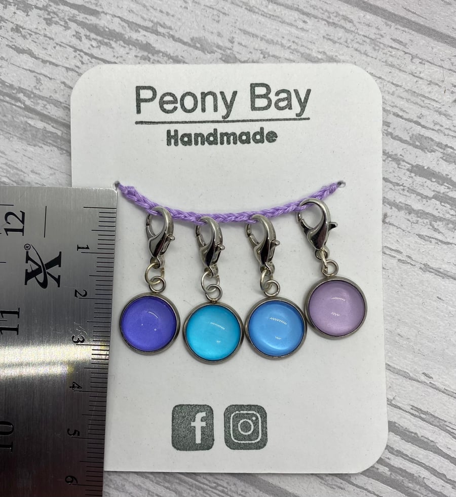 Set of 4 stitch markers in blue and lilac
