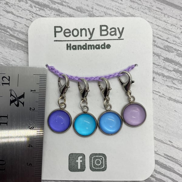 Set of 4 stitch markers in blue and lilac