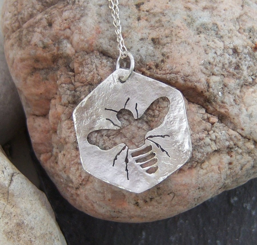 Bee and honeycomb pendant in sterling silver