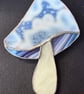 Stained glass mushroom - mottled white cap with blue and purple gills
