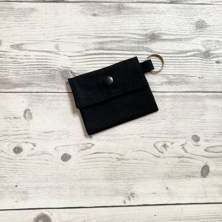 Plain black colour round lip balm keyring, keychain, lipstick holder.