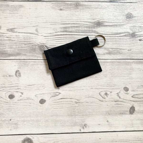 Plain black colour round lip balm keyring, keychain, lipstick holder.