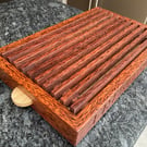 A premier coconut palm and oak crumb catcher bread board