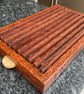 A premier coconut palm and oak crumb catcher bread board