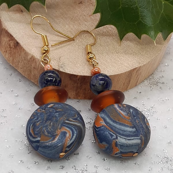Polymer clay dangly disc earring with a hint of sparkle