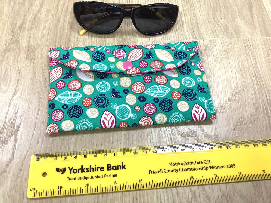 Fabric glasses case holder with popper fastener.