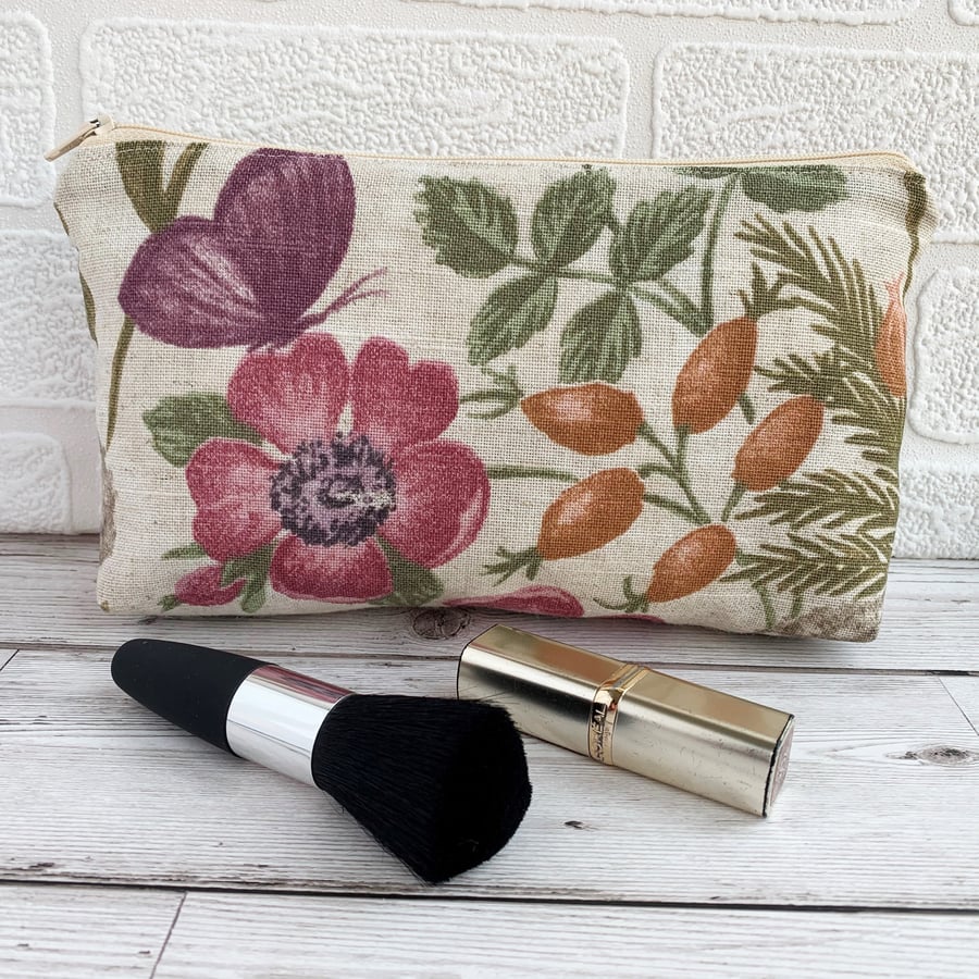 Make up bag, cosmetic bag with purple butterfly amongst flowers and seed pods