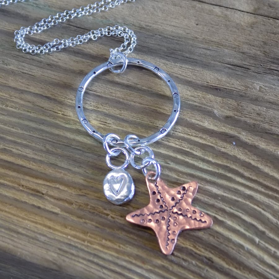 Sterling silver love heart nugget and copper starfish hoop pendant