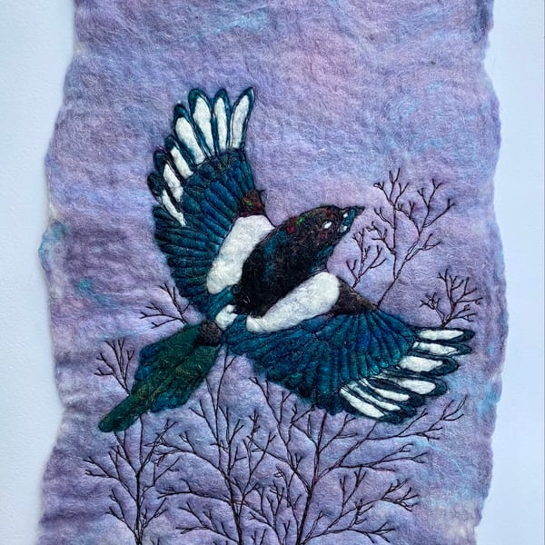 Magpie flying original Artwork. Wet felting with free motion embroidery. 