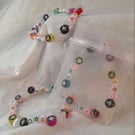 Elastic beaded bracelet with glow stars