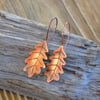 Copper oak leaf earrings, rustic flame painted style
