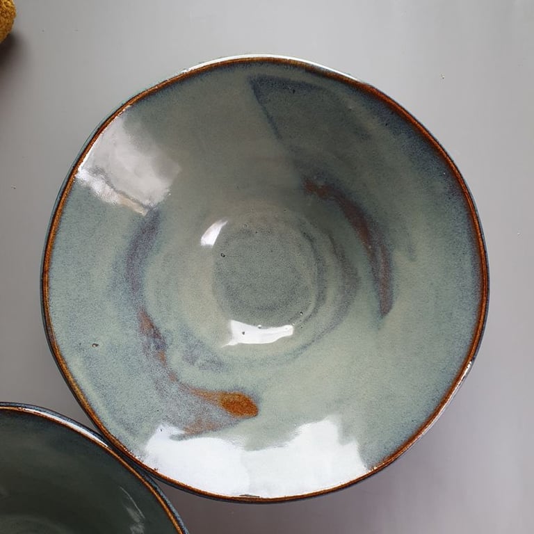 Textured conical slab made pottery bowl in blue with brown highlights 